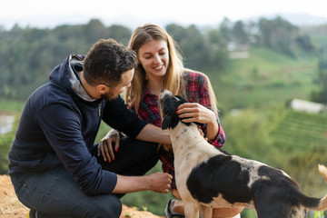couple in love with a dog in the mountains © Rock and Wasp