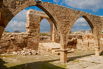 Fototapeta na wymiar The 12th century ruins of the stone church Panagia Odigitria in Kouklia Paphos Cyprus. The Holy Church of Pangia Katholikis Kouklia