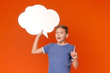 Young Boy looking up and thinking with light bulb in bubbles
