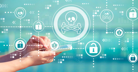 Virus and scam theme with person holding a white smartphone