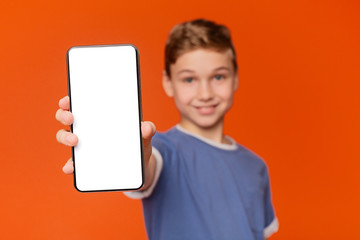 Cute boy man showing blank cellphone screen