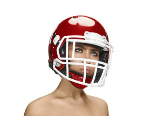 American football theme. Young beautiful woman in helmet isolated on white. Skin protection concept