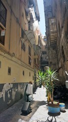 NAPLES, ITALY - MAY 22, 2014: The neighborhood called "Quartieri Spagnoli" in Naples in a typical day, with colorful streets and fessed are a world attraction. to many tourists.