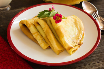 Tasty crepes with caviar. French crepes, russian or ukrainian on white background. Maslenitsa holiday food