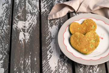 spinach pancakes, on wooden grey backdrop