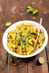 pasta with pesto sauce and arugula