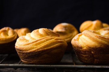 Modern fashionable pastries - scones cruffins (puffmaffin) a mixture of a croissant and maffin