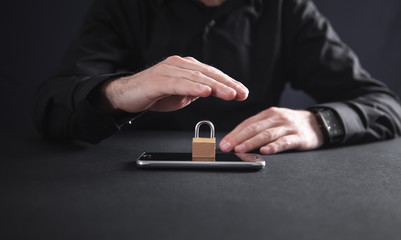 Man hand protect phone. Mobile and internet security concept