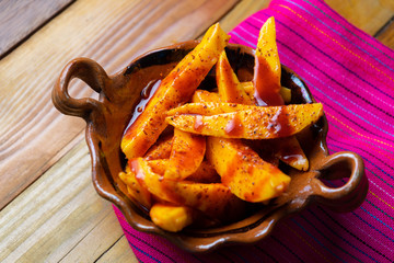 Mexican mangoes with chili powder and chamoy