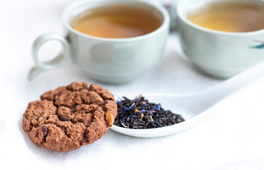 Tea and cookies on the white background. 