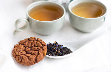 Tea and cookies on the white background. 