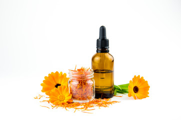 Dry Calendula officinalis, the pot marigold, ruddles, common marigold or Scotch marigold blossoms...
