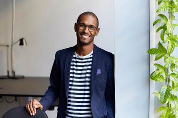 Portrait of smiling man in creative office