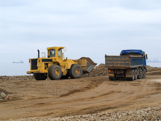 Construction excavator working in construction site