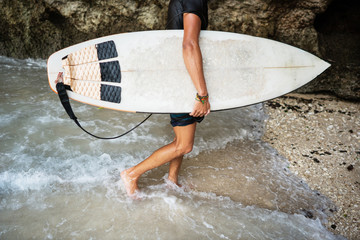 surfer guy goes to sea with a surfer board