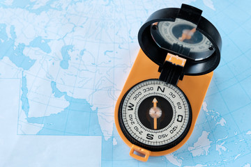 Old compass on a geographical map. Contour map. Travel, travel concept.