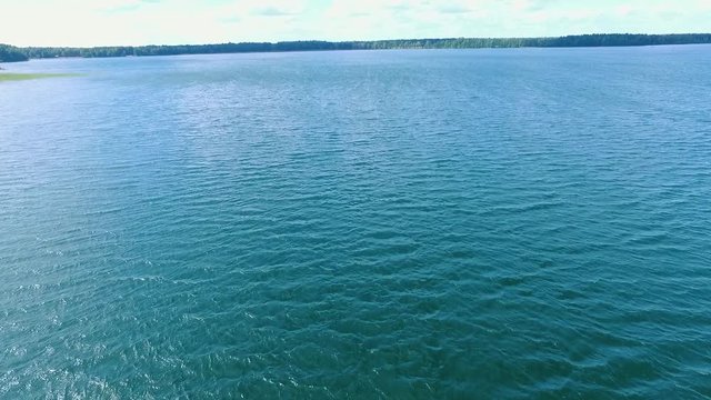 Drone shooting of awesome blue lake. Shatsky lakes in Ukraine. Amazing sky with white clouds. Outdoors. Marvelous view from above. Outside.