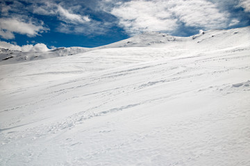 Winter panoramic view of a snowy mountain slope, of a mountain, in Switzerland.