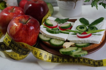 Diet - slimming .Weight loss concept with red apple, vegetables and dairy products