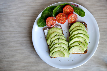 open toasts with avocado