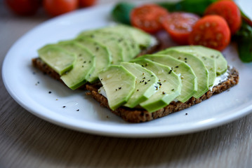 open toasts with avocado