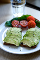 open toasts with avocado