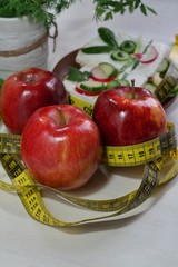 Diet - slimming .Weight loss concept with red apple, vegetables and dairy products