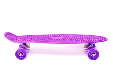 Pink penny board on a white background for girls to skate