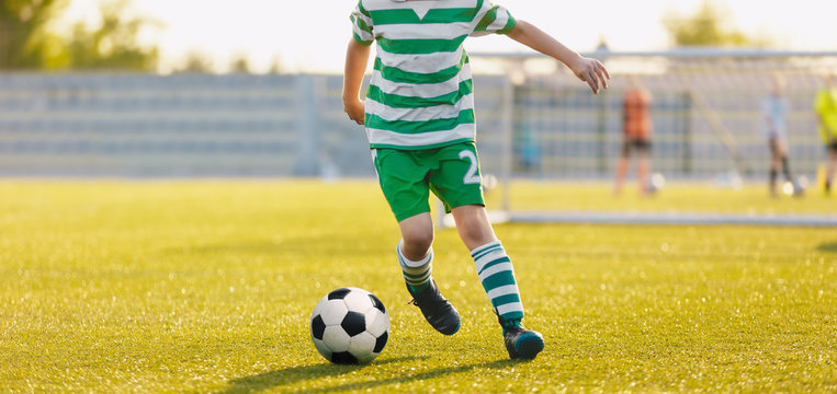 Kid Kicking Soccer Ball Close Up Action Of Boy Soccer Player Running After Ball Aged 8 10 Playing A Football Match Stock Photo Adobe Stock Kid Kicking Soccer Ball Close Up Action Of Boy Soccer Player Running After Ball Aged 8 10 Playing A Football Match Stock Photo Adobe Stock