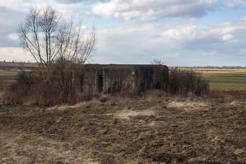 Destroyed soviet bunker, pillbox. Reinforced concrete defensive military structure. Molotov system...