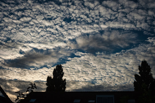 A Fallstreak Hole, Also Known As A Punch Hole Cloud Or Cloud Hole, Appearing In Altocumulus Clouds