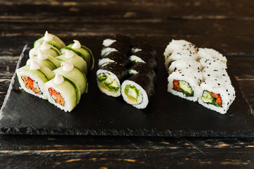rolls with fresh fish, vegetables and cream cheese