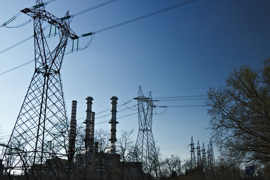Turbigo. Milan. Lombardy. Italy. March 24 2019. Chimneys, pylons and cables of the power plant.