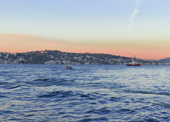 fishing boat in Istanbul Strait. sailing boat at sunset.