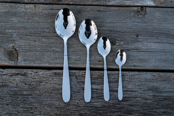 knife and fork on wooden background. Cutlery on wooden.