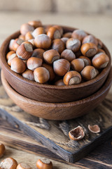 Hazelnuts on rustic wooden background. Food background. Print for kitchen