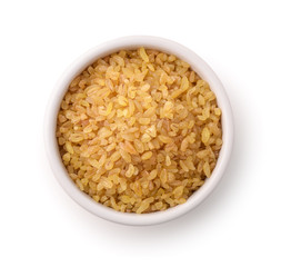 Top view of uncooked bulgur in ceramic bowl