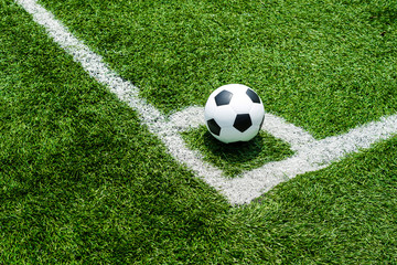 soccer Football on Corner kick line of ball and a soccer field , football field , background texture