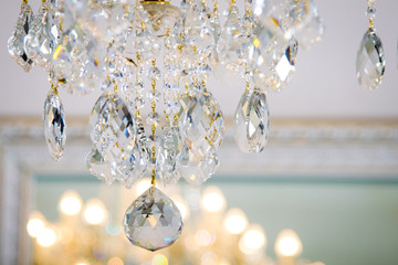 Crystal chandelier on the background of the window