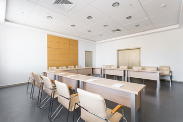 Empty modern conference hall in new hotel. Room for training, education, group classes, exams. Audience for Speakers at Business convention and Presentation.