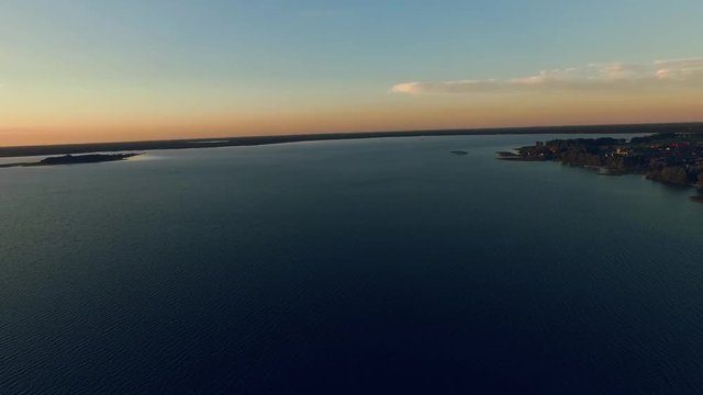 Lake with little islands. Evening time out of town. Famous Shatsky settlement in Western Ukraine. Drone footage. Outdoors. Summertime. Tourist attraction.