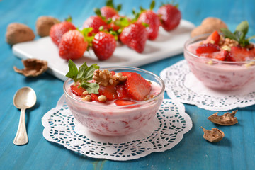 strawberry dessert with walnut pieces - closeup