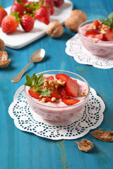 strawberry dessert with walnut pieces - closeup