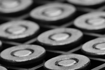 Pile of pistol bullets. The concept of limiting the spread of small arms. Black and white image