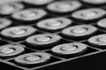 Pile of pistol bullets. The concept of limiting the spread of small arms. Black and white image