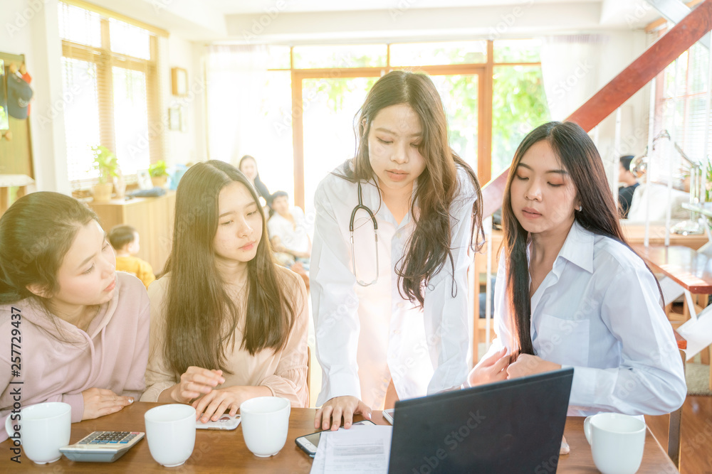 Wall mural business women co working group make idea discussion with laptop