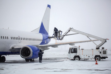 Aircraft handling protection against freezing aircraft. Process of covering passenger airliner with liquid against freezing before departure