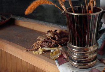 red glass vase on windowsill