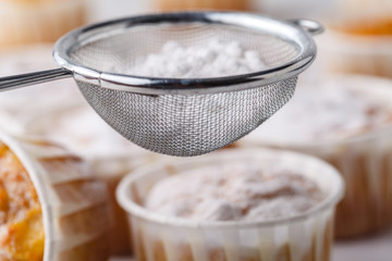 sweet pumpkin muffins with walnuts and powdered sugar