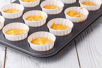 Pumpkin muffins with cream and candied fruits